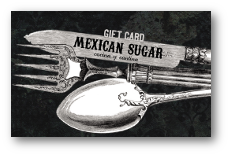 spoon, fork, knife. on blade of knife says Mexican Sugar. All over black background